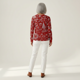 Charline - Pull de Noël rouge à motifs blancs